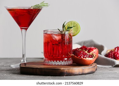 Glasses Of Tasty Pomegranate Cocktail On Table