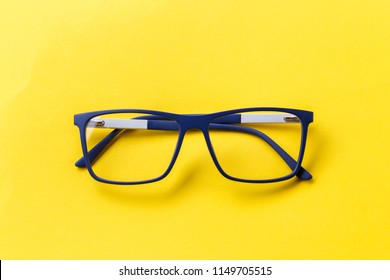 glasses with transparent lenses with diopters on a yellow background. stylish accessory
