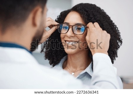 Glasses, vision and optometry with a black woman customer in an optician office for consulting. Eyewear, frame and frame with a doctor or consultant helping a female patient to correct eyesight