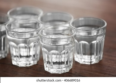 Glasses Of Water On Wooden Background