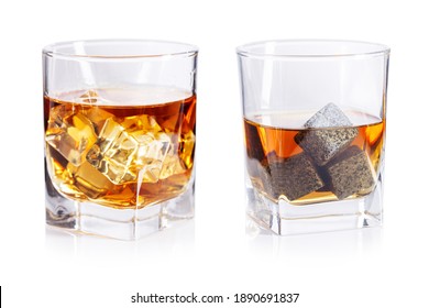 Glasses of whiskey with stones and ice isolated on white