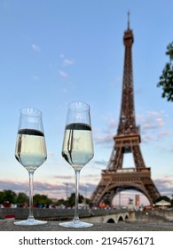 Glasses Of White Wine In Paris With Eiffel Tower