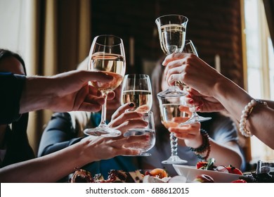 Glasses Of White Wine Seen During A Friendly Party Of A Celebration.