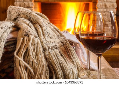 Glasses Of Wine Against Cozy Fireplace Background, Winter Vacation, Winter Vacation, In Country House, Horizontal.