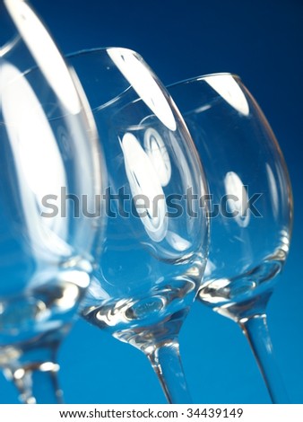 Glasses of wine on a blue background