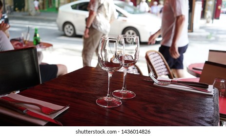 Glasses Of Wine On A Restaurant Table In Paris