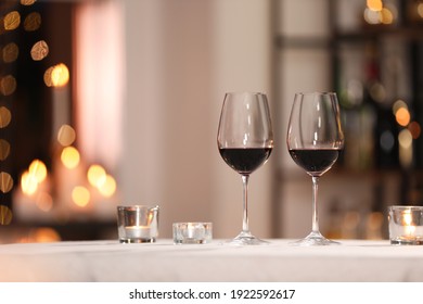 Glasses Of Wine For Romantic Dinner On Table In Restaurant