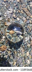 Glassmarble inside a river