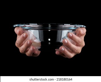 Glassware. Hands Holding Empty Bowl On A Black Background.