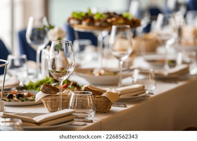 Glassware on a served table in a restaurant lined up perspective - Shutterstock ID 2268562343