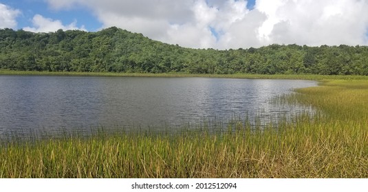 Glassy Lake In The Mountains