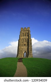 Glastonbury Tor against a vivid blue sky Somerset England