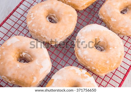 Similar – Image, Stock Photo round red glazed donut and paper cup with coffee