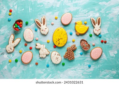 Glazed color gingerbread Easter figures - rabbit, chicken, egg, carrot   on bright background. Happy Easter. Top View - Powered by Shutterstock