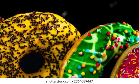Glazed donuts with sprinkles isolated. Close up of colorful donuts. - Powered by Shutterstock