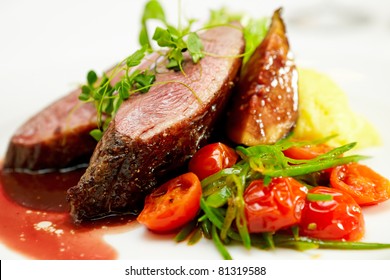 Glazed duck fillet, mashed potatoes seasoned with truffle oil, fig and aniseed sauce - Shutterstock ID 81319588