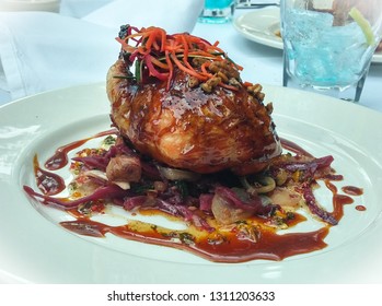 Glazed Quail Dish With Walnut, Carrot, And Red Onion. New Orleans, Louisiana. November 2014