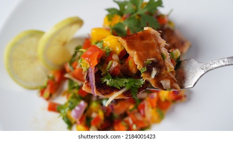 Glazed Salmon Fillet With Mango Salsa, Herbs And Lemon