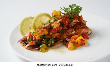 Glazed Salmon Fillet With Mango Salsa, Herbs And Lemon