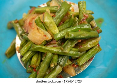 Glazed Salmon And Green Long Beans On Blue Background.