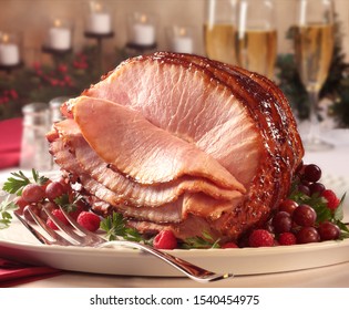 Glazed Spiral Ham On White Platter.