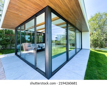 glazed terrace in the countryside with sliding glass - Shutterstock ID 2194260681