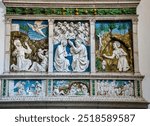 Glazed terracotta altarpiece by the master Luca della Robbia. Work of the early Renaissance 14th century in the parish church of Saints Flora and Lucilla in Santa Fiora Tuscany Italy