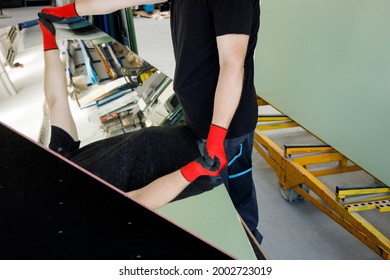 The Glazier Places The Mirror Top On A Professional Table In The Glass Factory 