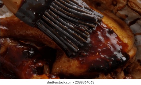 Glazing Raw Chicken Leg with Teriyaki Sauce Close-up. - Powered by Shutterstock