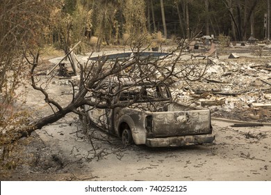 GLEN ELLEN, CALIFORNIA/ USA - OCT 16, 2017: A Burned Car Near The Remains Of A Home In A Sonoma County Neighborhood. Fires In California Have Burned Over 220,000 Acres And Destroyed 5700 Structures.