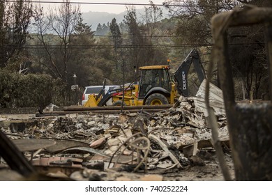 GLEN ELLEN, CALIFORNIA/ USA - OCT 16, 2017: A Bulldozer Clears A Path In A Destroyed Sonoma County Neighborhood. Fires In California Have Burned Over 220,000 Acres And Destroyed 5700 Structures.