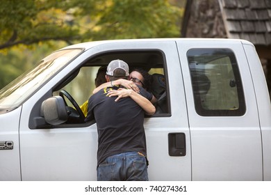 GLEN ELLEN, CALIFORNIA/ USA - OCT 14, 2017: Friends Reunite At A CHP Road Block. The Man Has Lost His Home. Fires In Northern California Have Burned Over 220,000 Acres And Destroyed 5700 Structures.