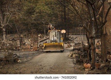 GLEN ELLEN, CALIFORNIA/ USA - OCT 16, 2017: A Bulldozer Clears A Path In A Destroyed Sonoma County Neighborhood. Fires In California Have Burned Over 220,000 Acres And Destroyed 5700 Structures.