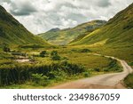 Glen Etive (James Bond Sykfall Road) in Glencoe, Scotland in the Scottish Highlands - as seen through a car wing mirror