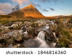 Glen Etive waterfall on a sunny Autumn morning in the Scottish Highlands.