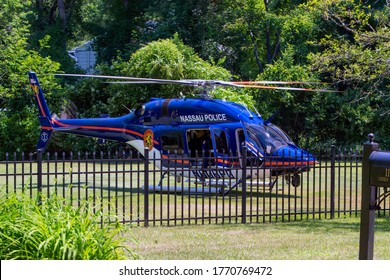 GLEN HEAD, NY - July 6, 2020: A Nassau County Police Helicopter Idles In The Front Yard Of A Linden Lane Home While Responding To An Accident At A Construction Site.