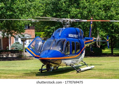 GLEN HEAD, NY - July 6, 2020: A Nassau County Police Helicopter Idles In The Front Yard Of A Linden Lane Home While Responding To An Accident At A Construction Site.