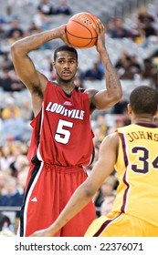 GLENDALE, AZ - DECEMBER 20: Louisville's Earl Clark #5 Prepares To Pass The Ball In The Basketball Game Against Minnesota On December 20, 2008 In Glendale, Arizona.