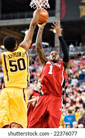 GLENDALE, AZ - DECEMBER 20: Louisville's Terrence Williams #1 Shoots The Ball Over Defender Ralph Sampson #50 Of Minnesota In The Basketball Game On December 20, 2008 In Glendale, Arizona.