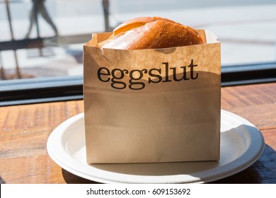 Glendale, CA: March 25, 2017: Eggslut sandwich at an Eggslut store in Glendale, CA.  Eggslut is a fast-food restaraunt.   - Shutterstock ID 609153692