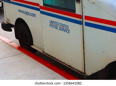 Glendale, California, United States – April 1, 2019: United States Postal Service Car Parked At Red Curve. US Postal Service Truck Parks On Red Painted Curb. 