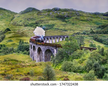 The Glenfinnan Viaduct railway viaduct on the West Highland Line in Glenfinnan Scotland. Located at the top of Loch Shiel the viaduct overlooks the Glenfinnan Monument and the Loch Shiel