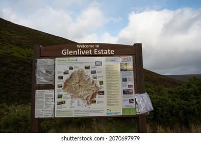 Glenlivet Estate, Scotland, UK, November 7 2021: Sign and information board at Glenlivet Estate in the Cairngorms National Park, Scottish Highlands. Background of moorland, hills, blue sky and clouds.