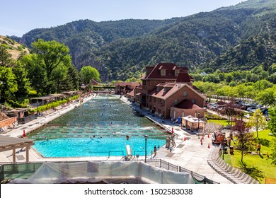 Glenwood Springs, USA - July 10, 2019: High Angle View Of Famous Colorado Hot Springs Pool In Downtown With Water And People Swimming