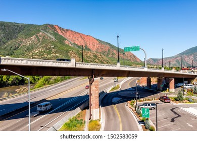 Glenwood Springs, USA - July 10, 2019: Aerial view of Roaring Fork Colorado river in downtown with water and overpass highway in summer