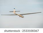 Glider against the blue sky. Light plane.