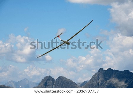 glider flying on swiss alps glacier view landscape panorama