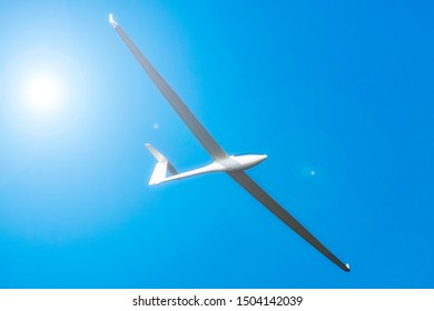 Glider Plane Flying In A Clear Sky