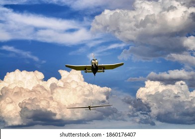 glider towed by plane just before takeoff motion blur effect
