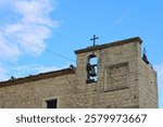 glimpse of the bell tower of the church of San Rocco in the Molise town of Cercemaggiore (Italy)
